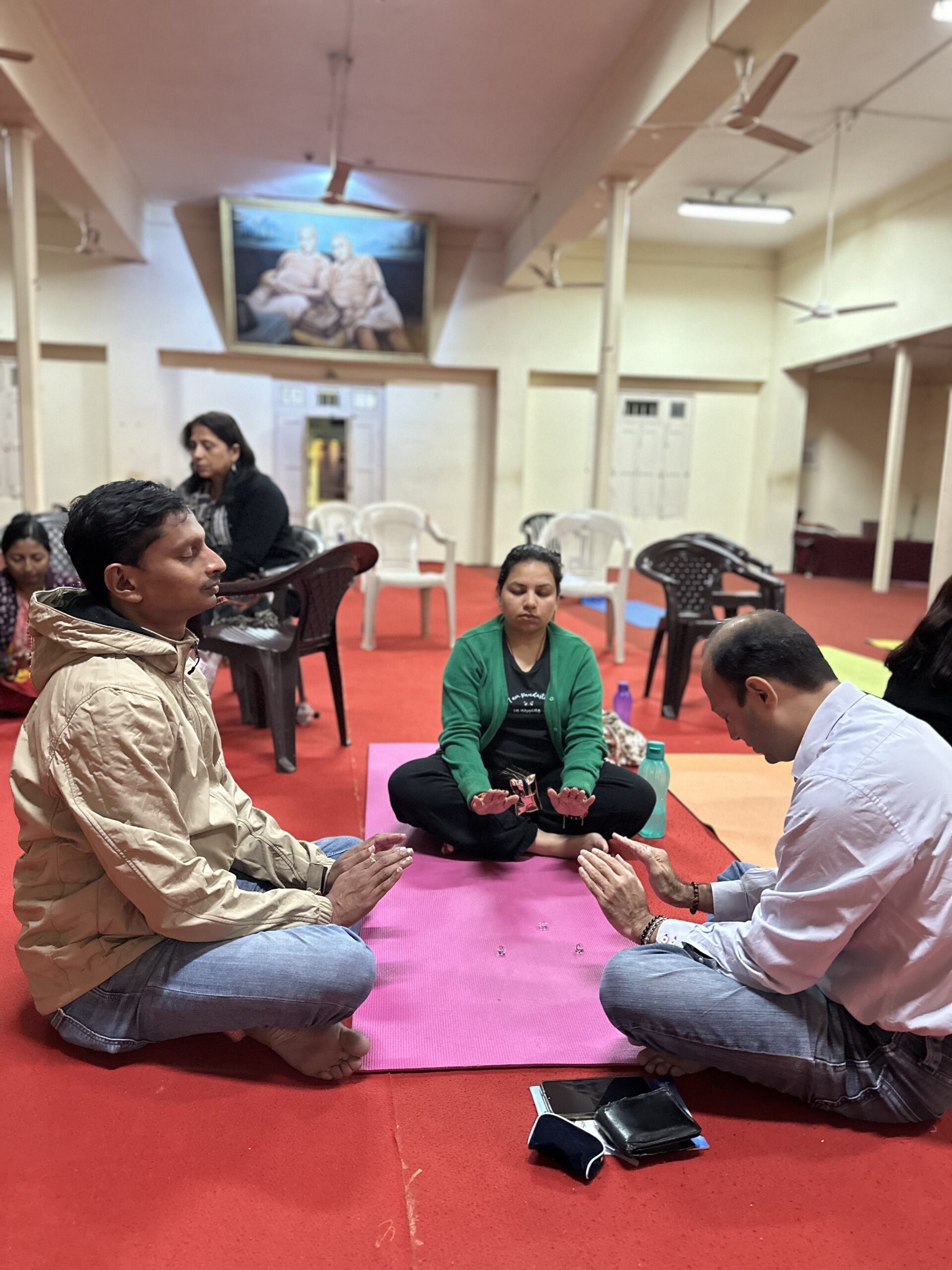 Participants meditating together during a group session