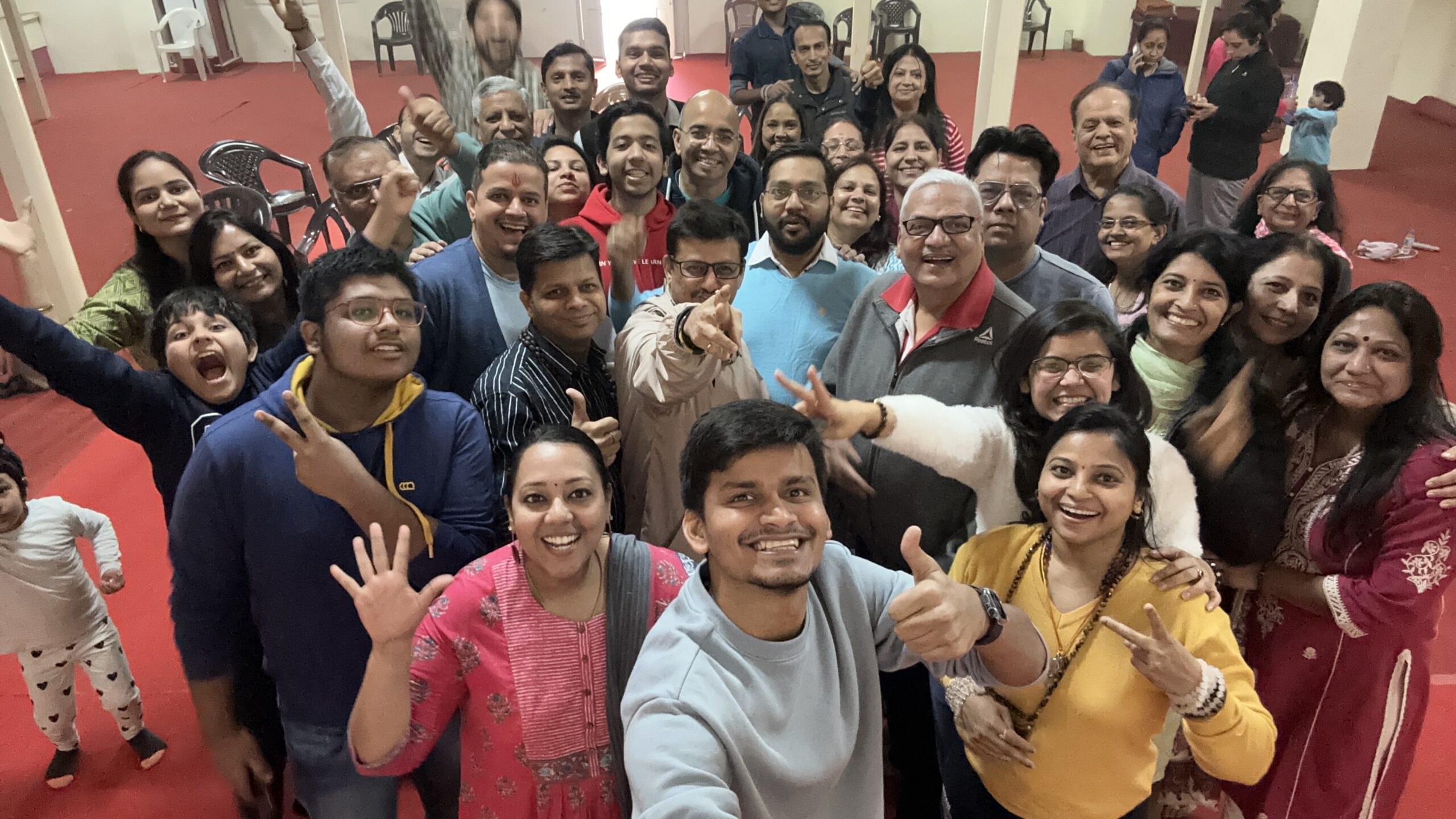 Group gathered together after an evening satsang by the water