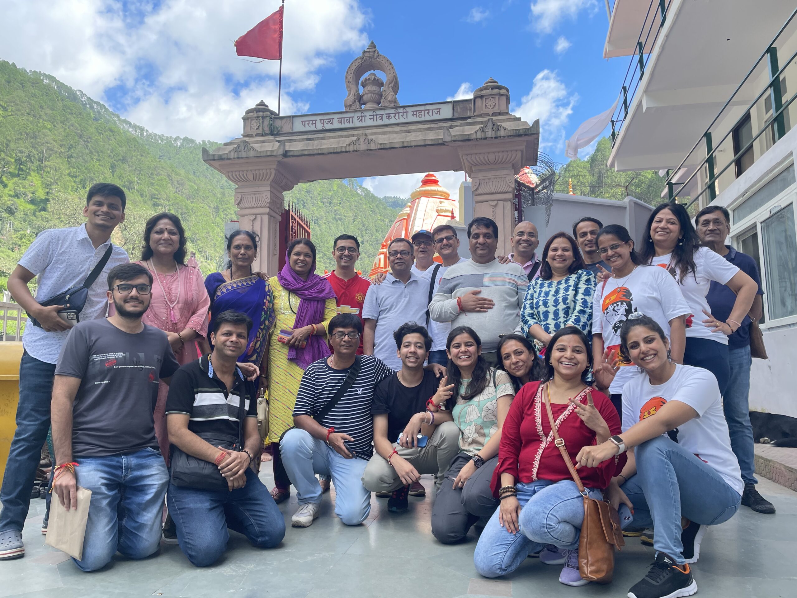 Joyful group photo of attendees inside the retreat hall